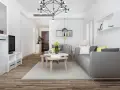 Nowe przepisy Airbnb: dlaczego od 20 maja 2026 r. każdy lokal musi mieć numer rejestracyjny? Nowoczesny salon z szarą kanapą i stolikami kawowymi.