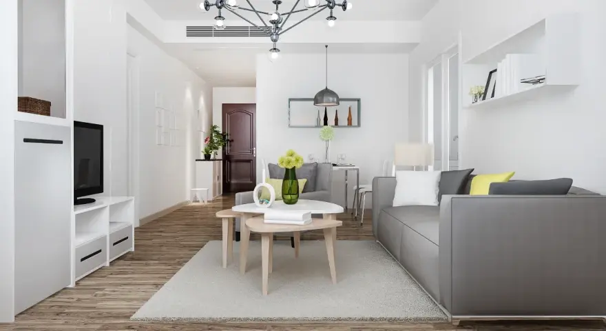 Nowe przepisy Airbnb: dlaczego od 20 maja 2026 r. każdy lokal musi mieć numer rejestracyjny? Nowoczesny salon z szarą kanapą i stolikami kawowymi.